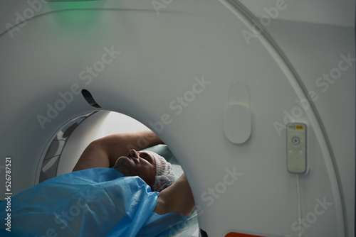 Εκτύπωση καμβά Man lies in tomography camera on diagnostic procedure upper body