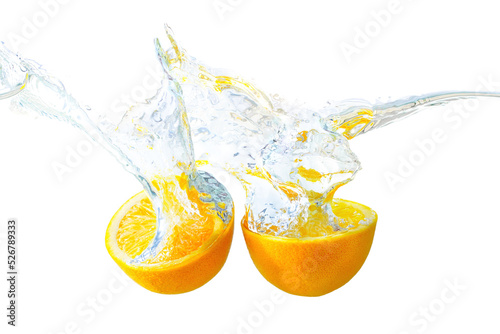 Halved oranges splashing in water isolated on white