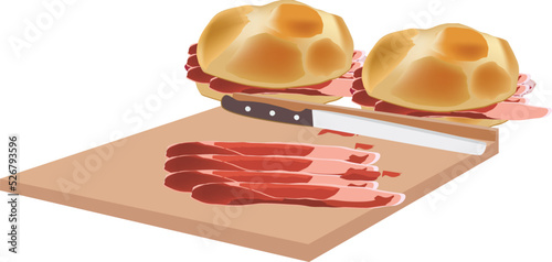 cutting board with slices of raw ham and sandwich-