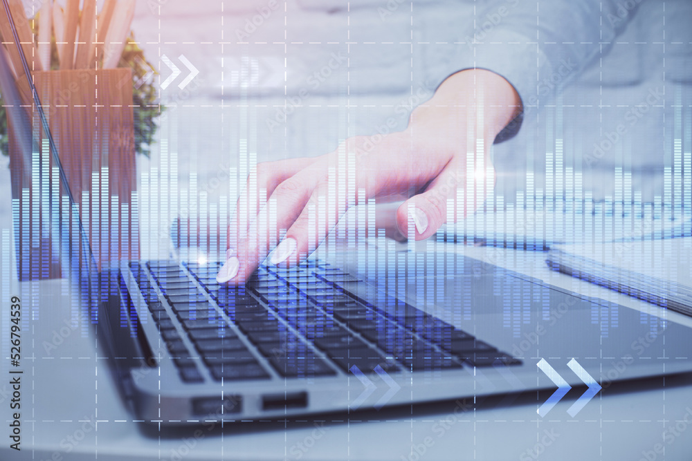 Multi exposure of woman hands typing on computer and forex chart hologram drawing. Stock market analysis concept. Multi exposure of woman hands typing on computer and forex chart hologram drawing. Stock market analysis concept.