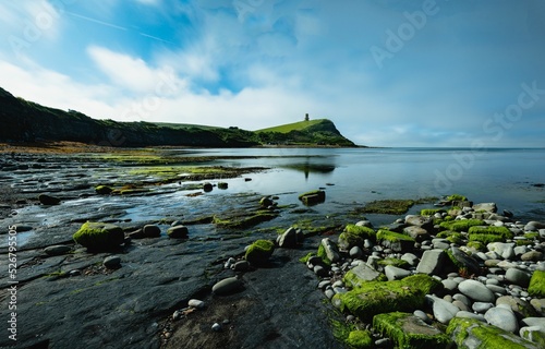 Beautiful view of Kimmeridge Bay with Clavell Tower in the background photo