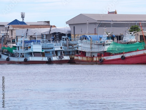 Industrial fishing boats are moored in port