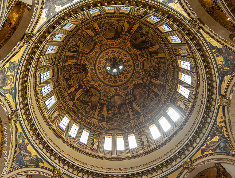 London, England, UK - July 6, 2022: St. Paul's Cathedral. Looking up inside dome. Light through windows, white statues and paintings galore.