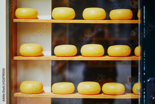Photography Many wheels of Dutch cheese on shop-window in Amsterdam, the Netherlands