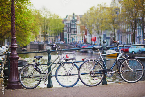 Many bikes parked on the bridges and embankments in Amsterdam, the Netherlands