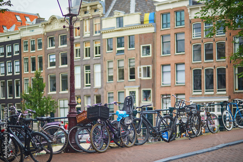 Many bikes parked on the bridges and embankments in Amsterdam, the Netherlands