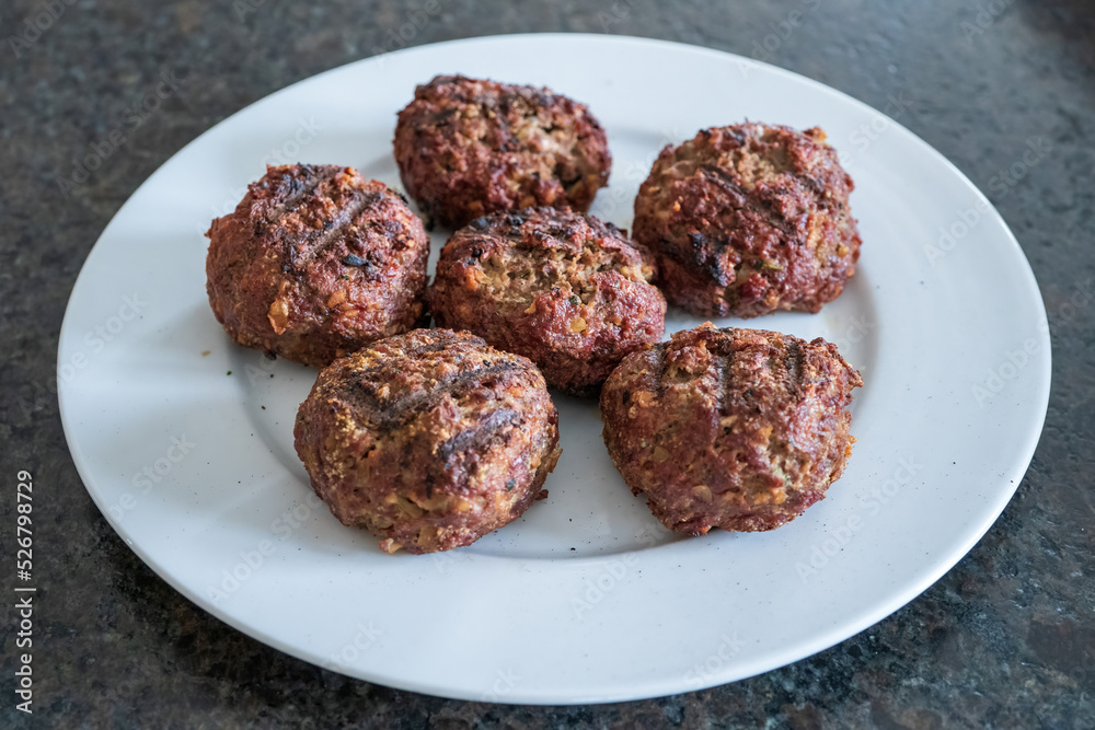 ready to eat - grilled venison burger from a charcoal grill ready to eat - grilled venison burger from a charcoal grill