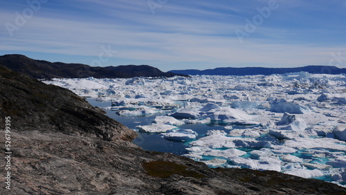Icebergs in the water close to coast at Ilulissat, Greenland