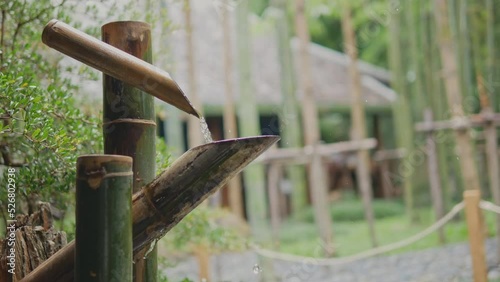 Bamboo water fountain or Shishi odoshi in Japanese garden is a Japanese device made to frighten away wildlife animals that might come to munch on plants of a well-cultivated garden.