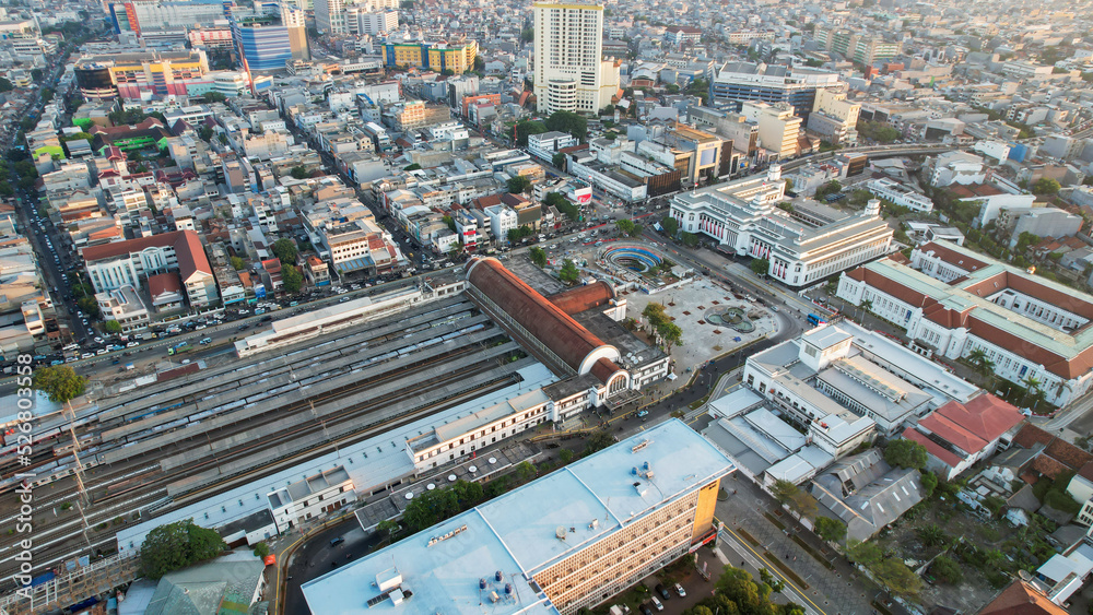Aerial view of Jakarta Kota Train Station with Jakarta cityscape background. 