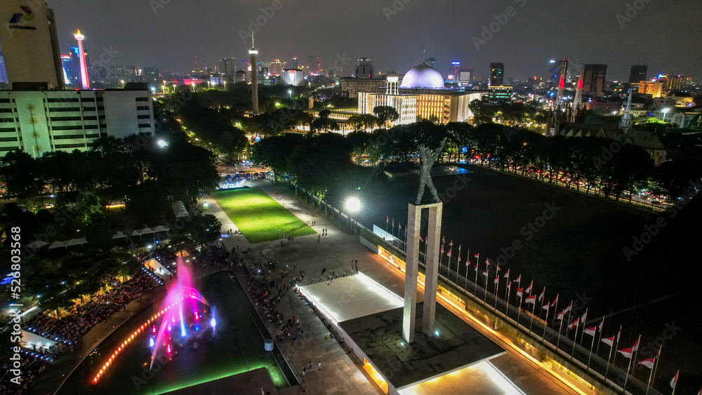 Aerial view of West Irian Liberation monument in downtown Jakarta with Jakarta cityscape. 