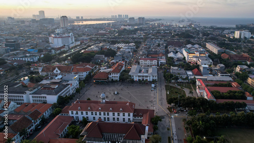 Aerial View. Fatahilah museum at Old City at Jakarta, Indonesia. With Jakarta cityscape and noise cloud when sunset.
