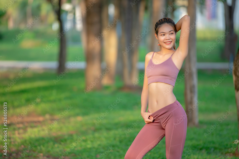 Asian beautiful slim woman at the park,Young girl love healthy exercise,Teen wear sportswear Asian beautiful slim woman at the park,Young girl love healthy exercise,Teen wear sportswear