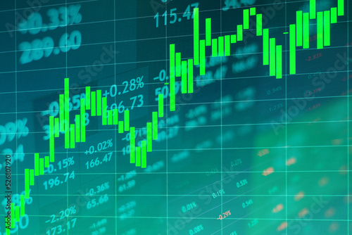 Rising stock market chart on dark background against the backdrop of stock quotes
