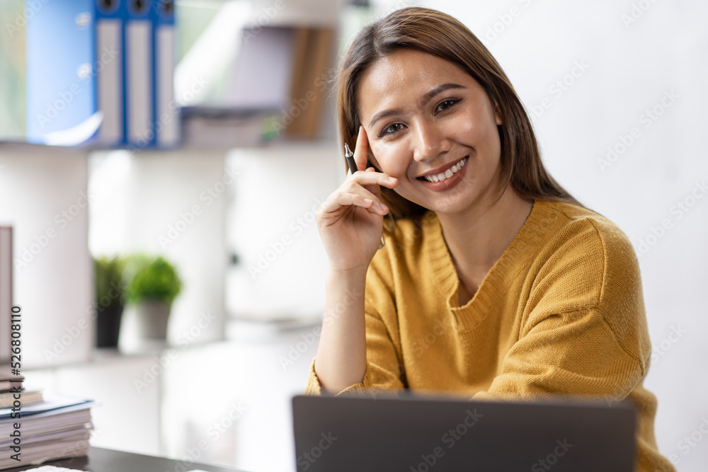 Business asian woman working on laptop computer managing her business in workplace, doing calculator planning document analyzing the financial report, business plan investment, finance analysis. Business asian woman working on laptop computer managing her business in workplace, doing calculator planning document analyzing the financial report, business plan investment, finance analysis.