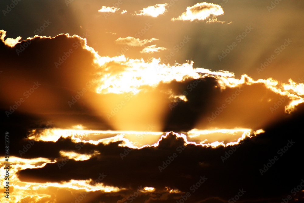 image of a beautiful sunset where the clouds and the sky shine in gold