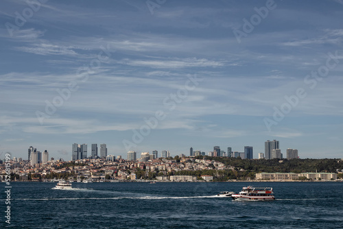 View of tour boats on Bosphorus and European side of Istanbul. It is a sunny summer day. © theendup