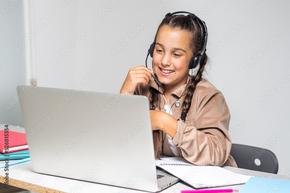 Beautiful dark-eyed dark-haired girl smiling and studying Beautiful dark-eyed dark-haired girl smiling and studying