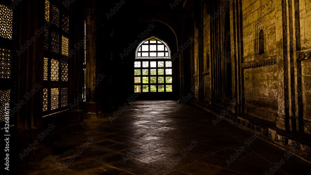 Obraz premium Light through lattice is Islamic architecture associated with the religion of Islam
