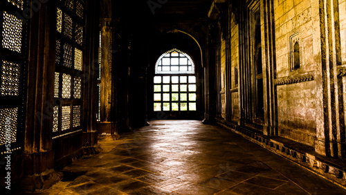Light through lattice is Islamic architecture associated with the religion of Islam © mrinal