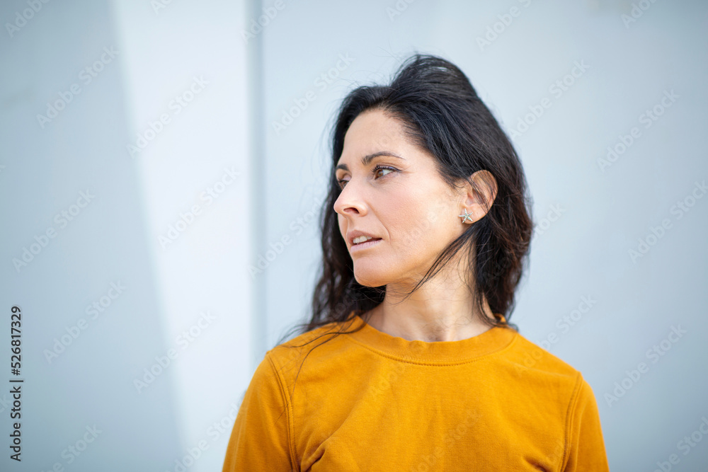 Fototapeta premium Beautiful caucasian woman looking to her side