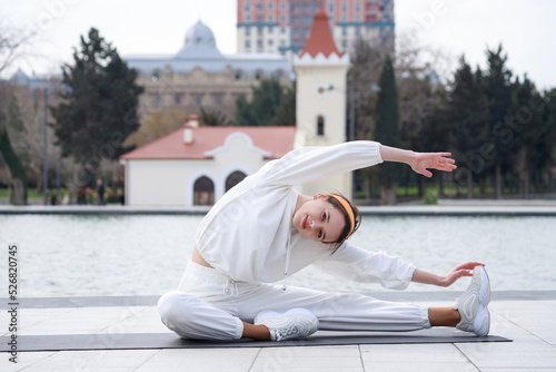 Young girl doing yoga meditation at the park © azerbaijan-stockers