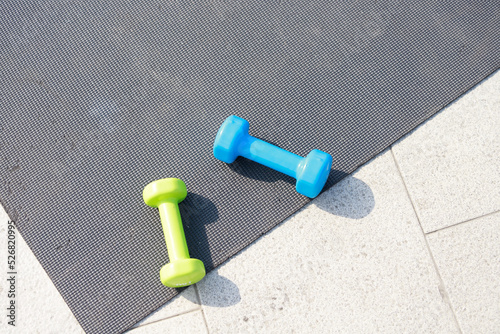 Photo of two dumbbells on the ground