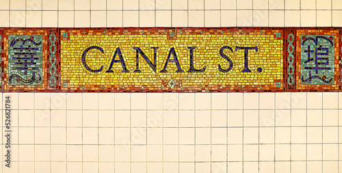 sign pointer at the entrance to the subway