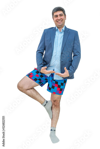 Man posing on a white background in a jacket and shorts
