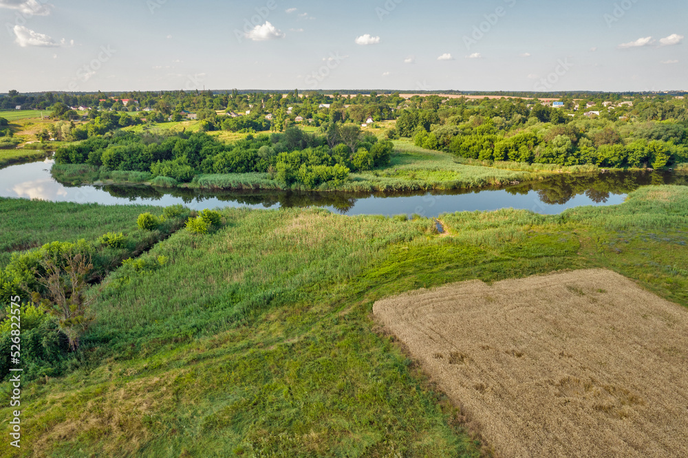 Drone view over summer sunset river Ros landscape, Ukraine.