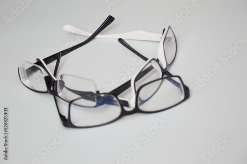 Glasses are transparent for reading or good vision, lie folded. on a light background. View from above