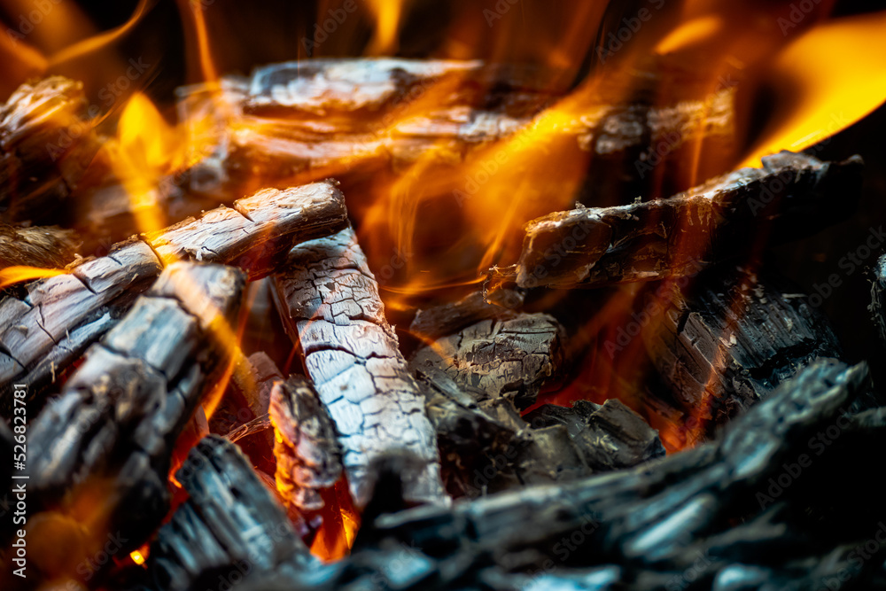 Fire burning inside a pit of charcoal Fire burning inside a pit of charcoal