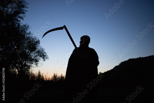 grim reaper, the death itself, scary horror shot of Grim Reaper holding scythe