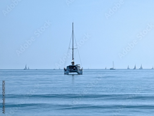 Sailboat floating on grand traverse bay photo