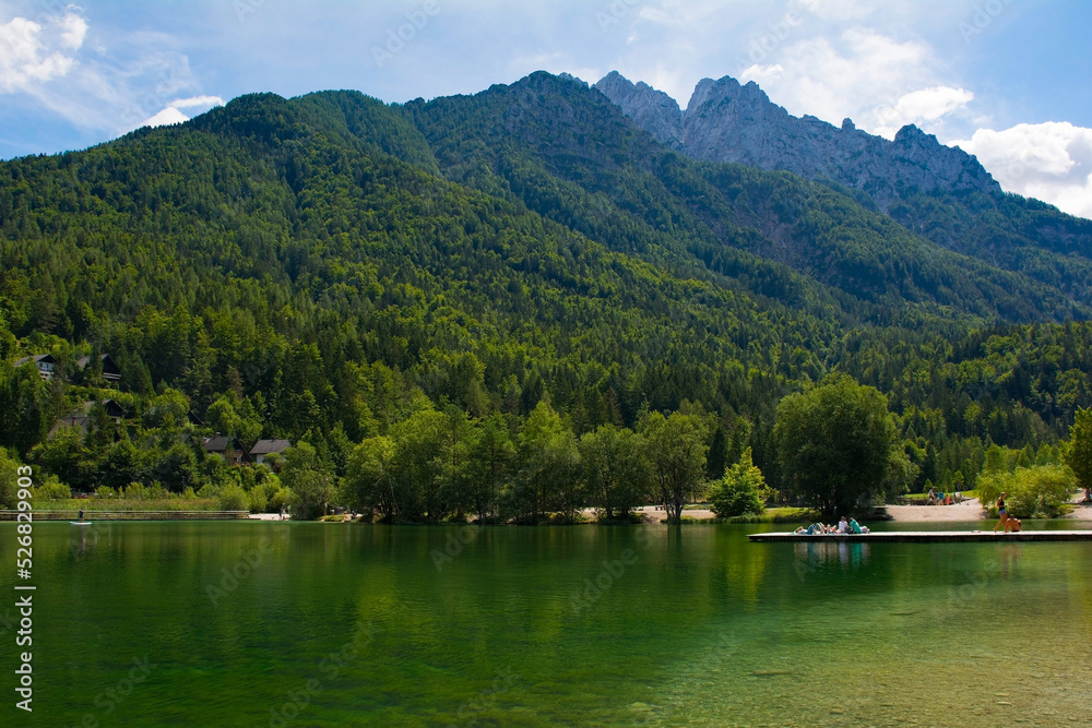 Fototapeta premium Jasna Lake near Kranjska Gora in the Upper Carniola region of north west Slovenia. An artificial lake created for tourism purposes 