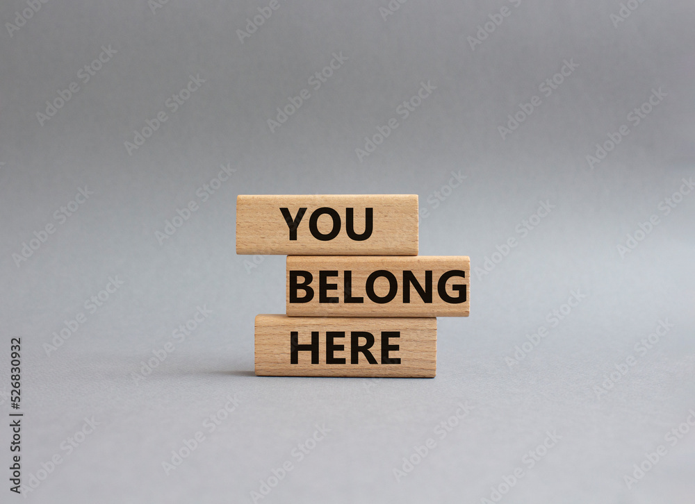 You belong here symbol. Wooden blocks with words You belong here. Beautiful grey background. Business and You belong here concept. Copy space. You belong here symbol. Wooden blocks with words You belong here. Beautiful grey background. Business and You belong here concept. Copy space.