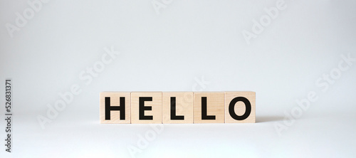 Hello symbol. Wooden cubes with word Hello. Beautiful white background. Hello concept. Copy space.