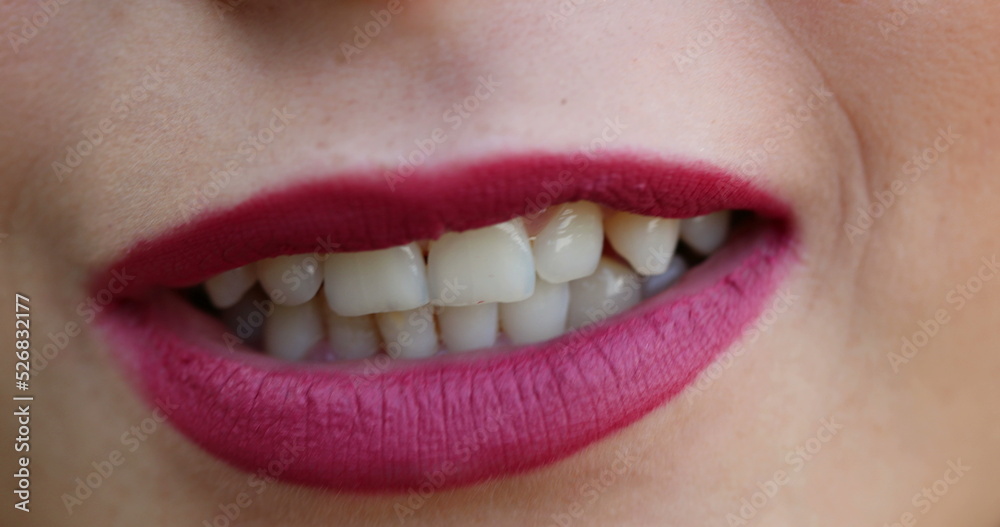 Lips macro closeup detail. Woman wearing red lipstick close-up face Lips macro closeup detail. Woman wearing red lipstick close-up face