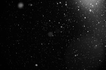Snowflakes falling down on black background, heavy snow flakes isolated, Flying rain, overlay effect for composition