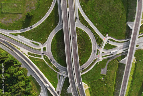 Top view of cars driving on round intersection in city, Transportation roundabout infrastructure, Highway road junction in Wroclaw, Poland