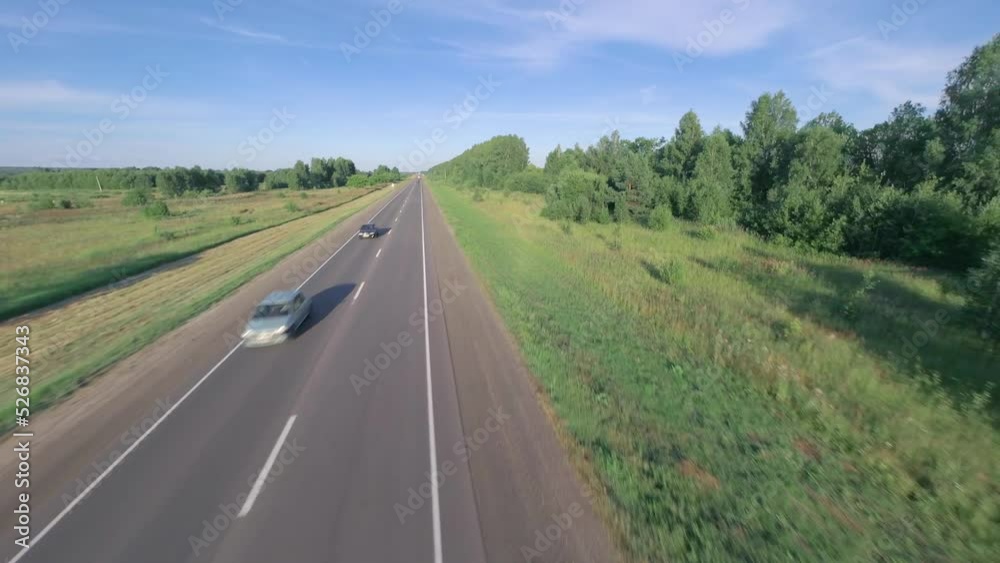 Trucks are driving on the road. Shooting from a fast drone. Trucks are driving on the road. Shooting from a fast drone.