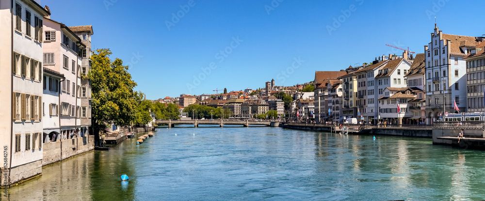Picturesque panoramic view of the Limmat River, the Rudolf Brun Bridge and the Church of Our Lady in Zurich, Switzerland