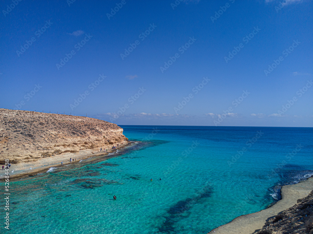 Bay with crystal water and blue sky 