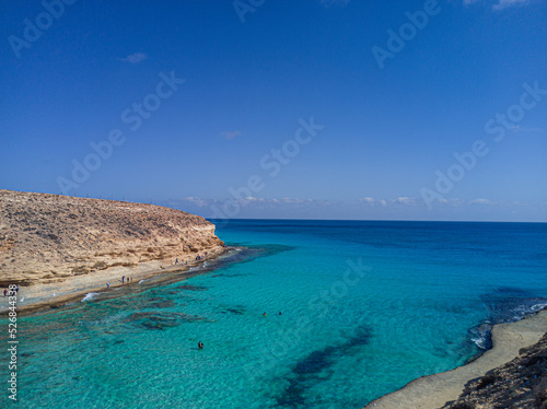 Bay with crystal water and blue sky 