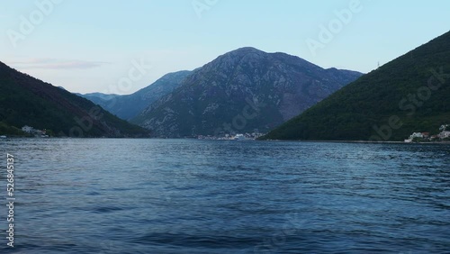 Boka Kotor Adriatic Sea, Verige Strait Kamenari Lepetane Ferry Line Trajekt. Strait between two mountains. The tourist ship sails. Tourism and business in Montenegro Maritime and water. August 16 photo