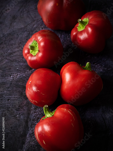 red bell peppers on black background