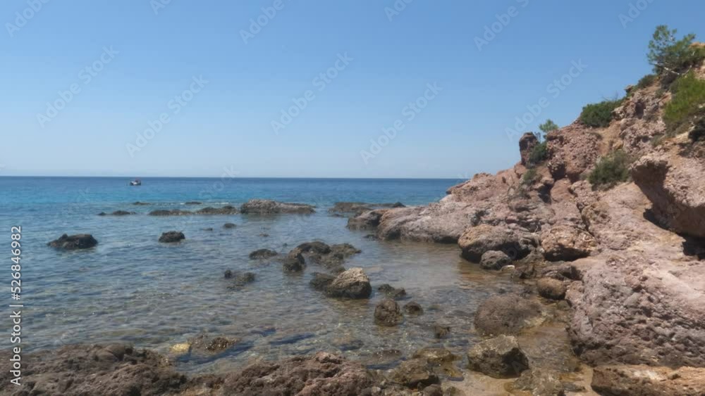 View of sea nature landscape, seascape, rocks beach shoreline. Turquoise color of water. Clear blue sky. Horizon. Summer holidays concept. View of sea nature landscape, seascape, rocks beach shoreline. Turquoise color of water. Clear blue sky. Horizon. Summer holidays concept.