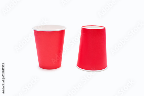 Disposable red cardboard cups isolated on white background. Disposable cups for drinks or coffee. Cardboard eco-friendly disposable cups