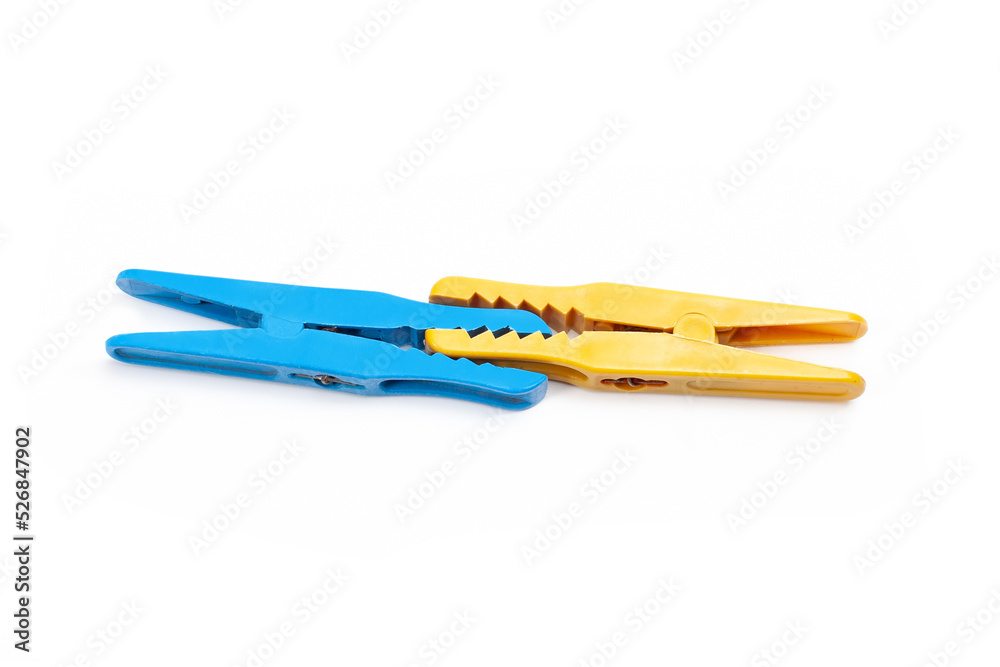yellow and blue clothespin attached together yellow and blue clothespin attached together