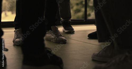 Group students legs hitting pushing in hall close up. School bullies fight. © stockbusters